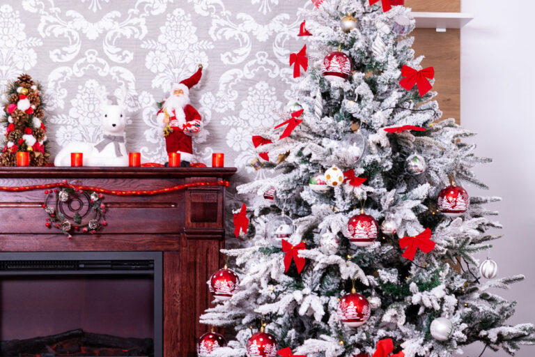 Christmas room with a Christmas tree and fireplace.